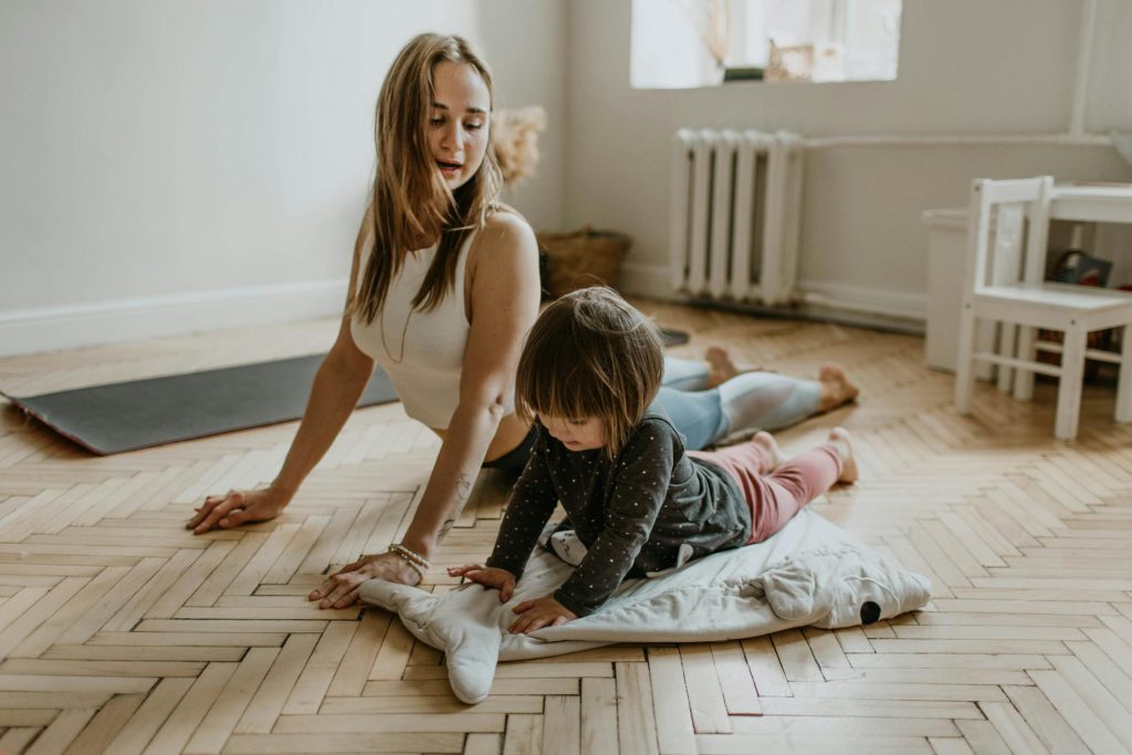 Mother and child practicing posture correction exercise at home in Lucknow
