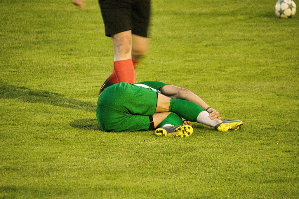 injured player lying on the field