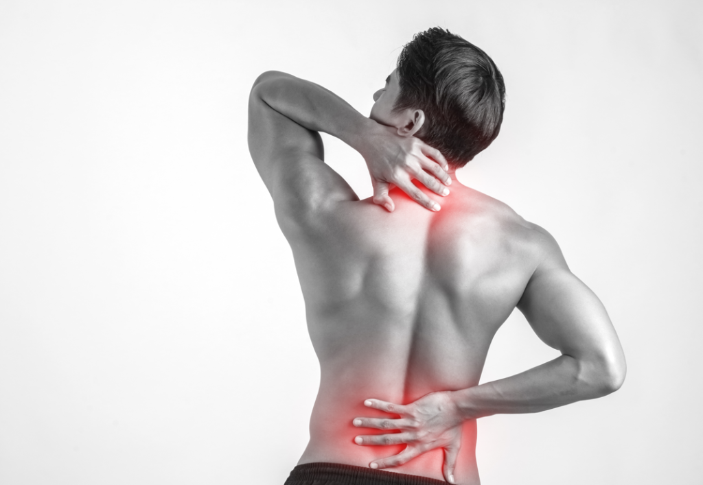 Man holding his lower back and neck, with the painful areas highlighted in red